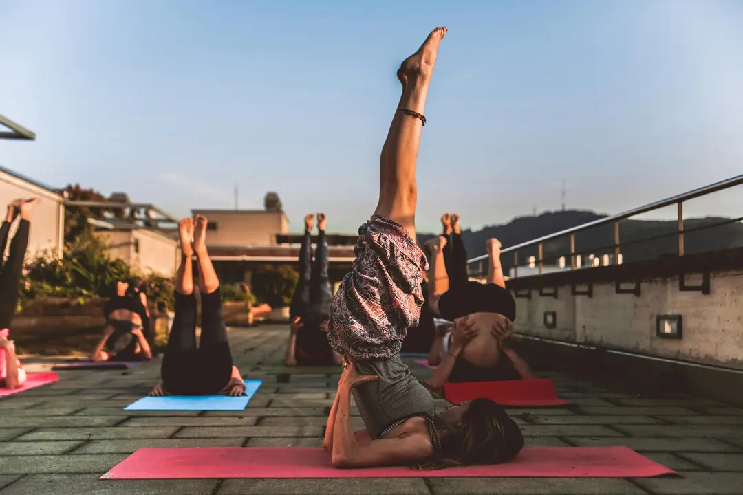 a group of people doing 200 hour hybrid yoga teacher training course in thailand